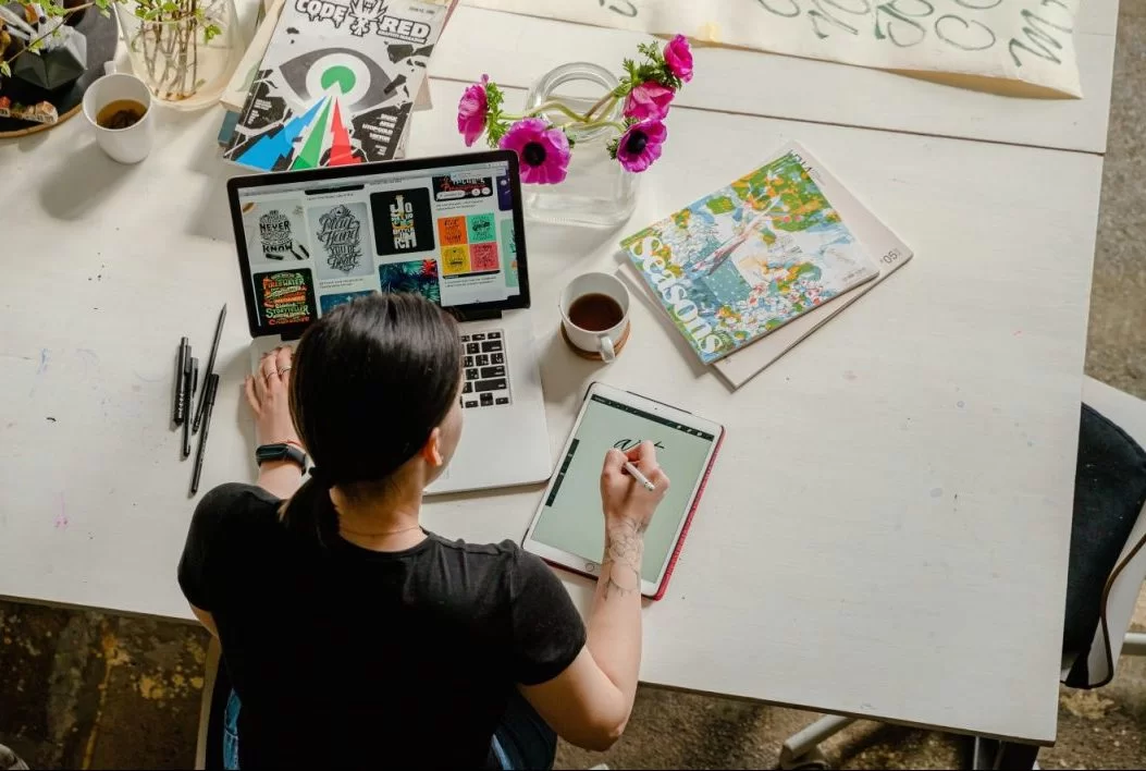 Artist working and sketching at desk